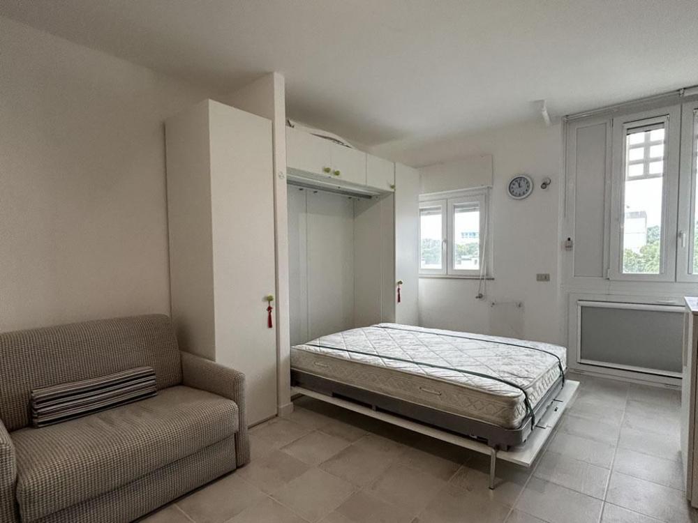 One-room apartment monolocale celeste interior