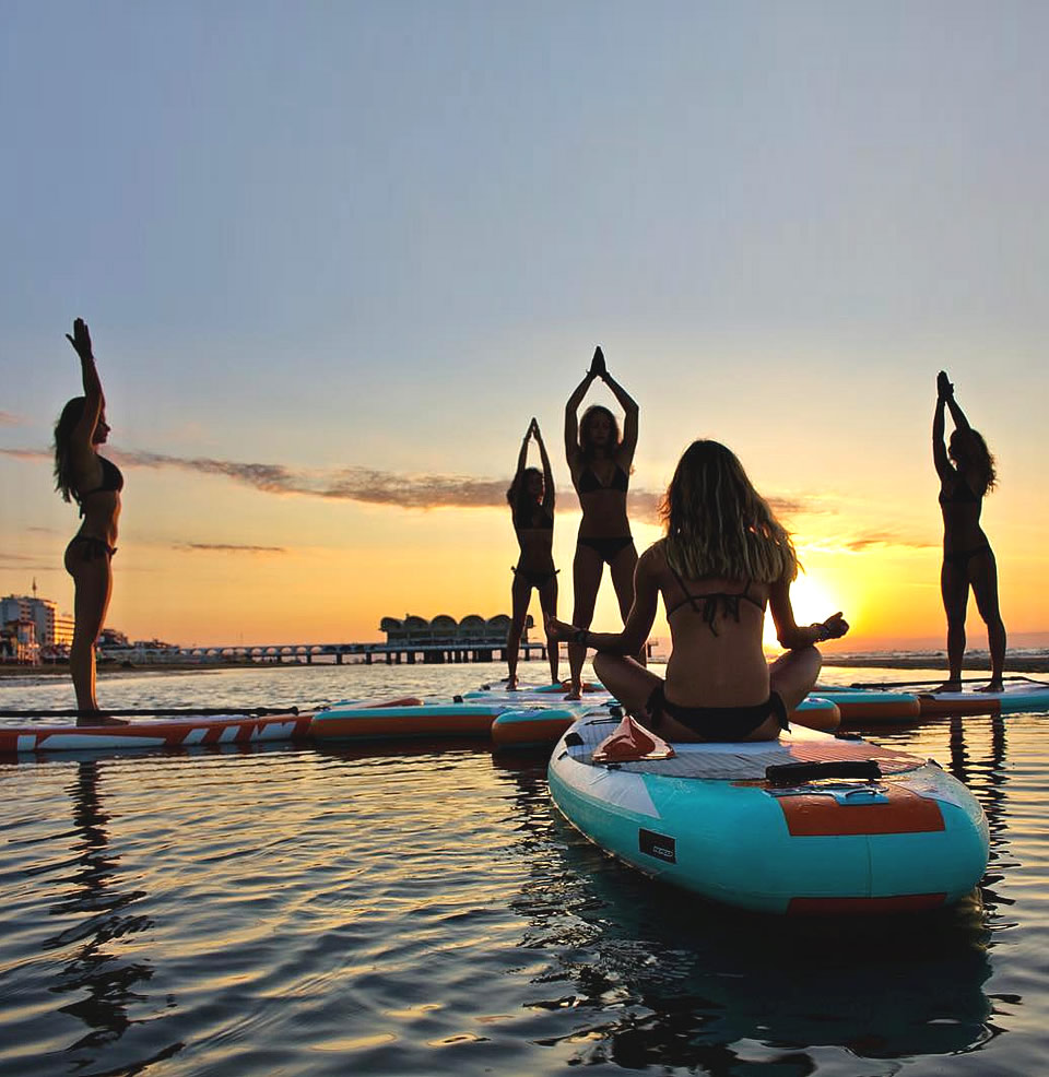 Water sports and yoga near the sea in Lignano Sabbiadoro